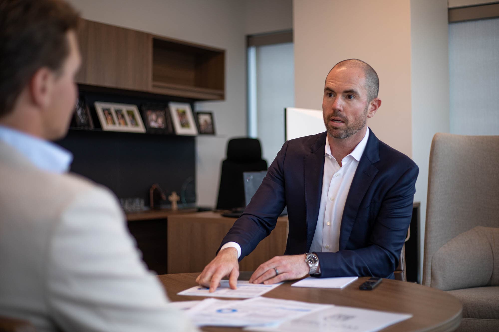 Heirloom advisor thoughtfully reviewing a liquidity event plan with a client